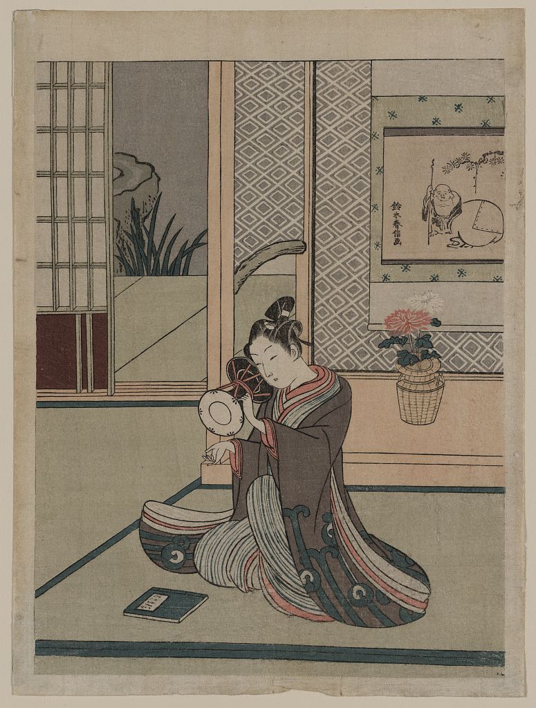 A colour woodcut of a young man playing a shoulder drum